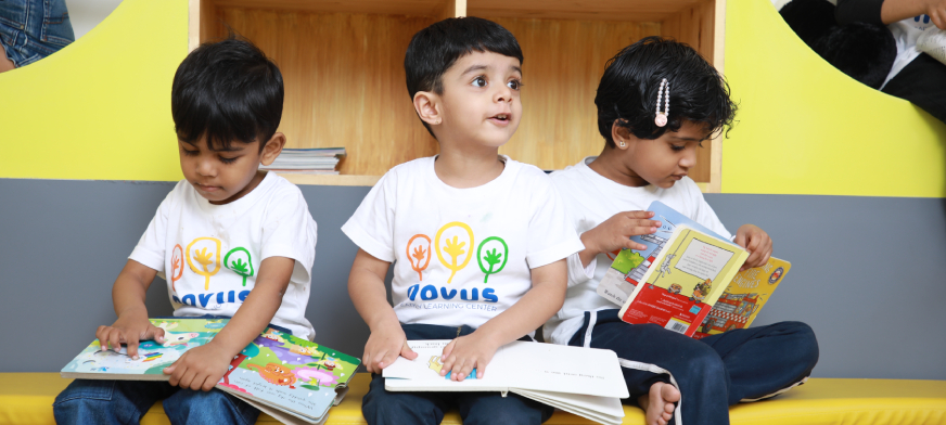 Children enjoying reading time at the best preschool in Yelahanka.